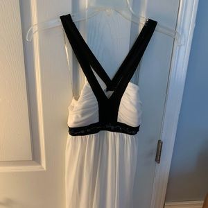 Beautiful sparkling white dress with black straps.